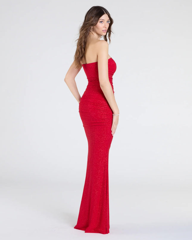 Make a statement in the Mischka Strapless Mermaid Glitter Formal Dress, a bold red prom dress designed to exude confidence, elegance, and a striking prom-night look.