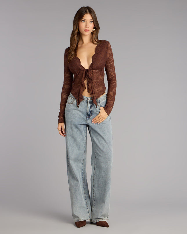 A trendy top that helps you feel festive and fashion-forward—style the Delicate Flair Floral Lace Tie-Front Top your way for parties, brunch with friends, or wherever you’re headed.